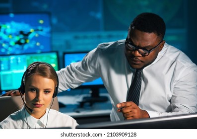 Aircraft Flight Control Officer Monitors The Approach Of Aircraft From Control Tower. Air Services Office Is Equipped With Navigation Systems, Radars And Computer Stations. Aviation Concept.