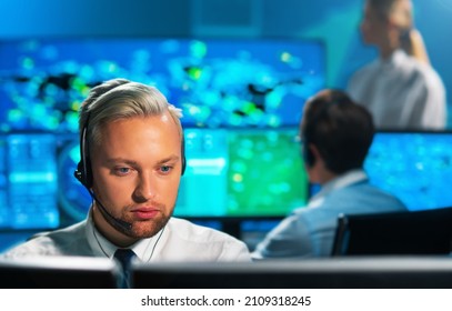 Aircraft Flight Control Officer Monitors The Approach Of Aircraft From Control Tower. Air Services Office Is Equipped With Navigation Systems, Radars And Computer Stations. Aviation Concept.