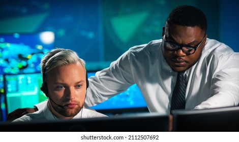 Aircraft Flight Control Officer Monitors The Approach Of Aircraft From Control Tower. Air Services Office Is Equipped With Navigation Systems, Radars And Computer Stations. Aviation Concept.