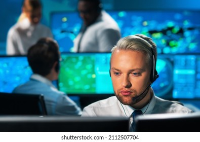 Aircraft Flight Control Officer Monitors The Approach Of Aircraft From Control Tower. Air Services Office Is Equipped With Navigation Systems, Radars And Computer Stations. Aviation Concept.