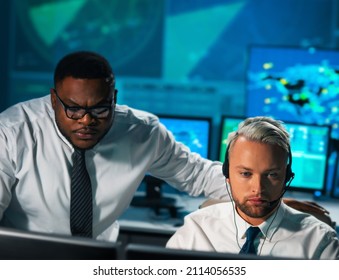 Aircraft Flight Control Officer Monitors The Approach Of Aircraft From Control Tower. Air Services Office Is Equipped With Navigation Systems, Radars And Computer Stations. Aviation Concept.