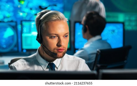 Aircraft Flight Control Officer Monitors The Approach Of Aircraft From Control Tower. Air Services Office Is Equipped With Navigation Systems, Radars And Computer Stations. Aviation Concept.