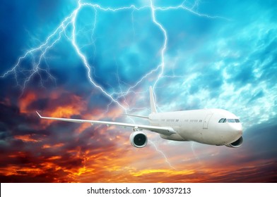 Aircraft flying in the night sky of lightning