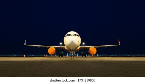 Aircraft Grounded With Engine Cover In Night