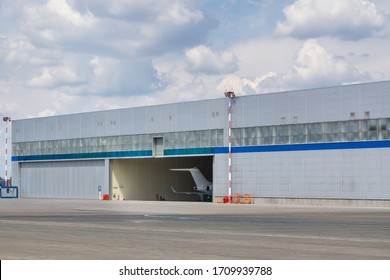 Aircraft Hangar Door Open. Plane Tail