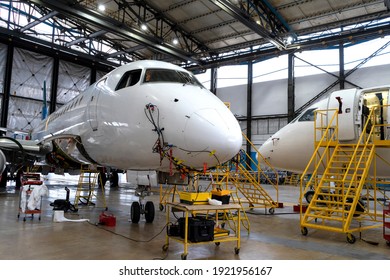 Aircraft Is In The Hangar For Technical Repair And Maintenance. Aircraft Diagnostics, Storage, Service. Plane. Ladders For Mechanics