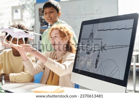 Aircraft image on computer screen in class where kids studying Aeromodeling