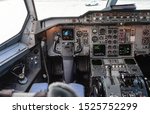 Aircraft interior, cockpit view inside the airliner. Point of view from a pilot place in a plane.