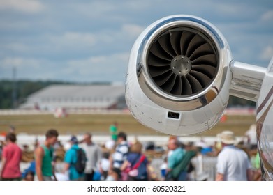 Aircraft Jet Engine With An Airshow Crowd Blurred In The Background