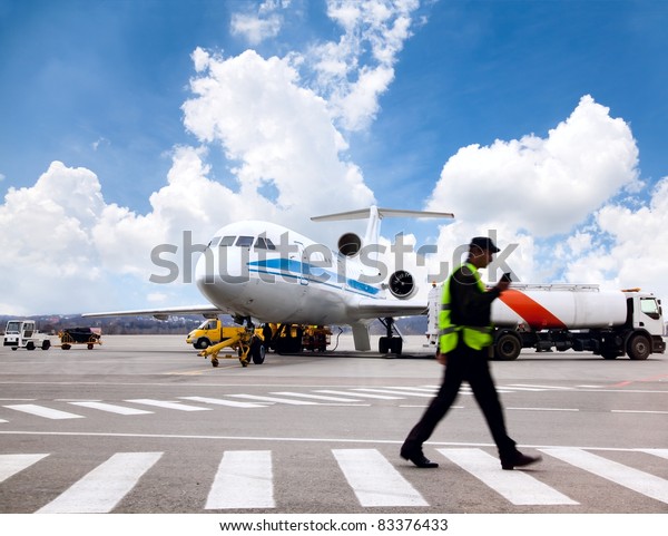 Aircraft maintenance\
people during\
refueling