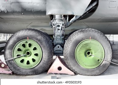 Aircraft Maintenance View Of Transport Airplane Turbo Prop Engine Gear Wheel Bay Interior Parts Of Plane Gear Strut Wheel Bay Door Maintenance Hatches  Wires Pipes Exterior Detail Side Close Up View