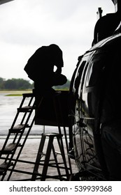 Aircraft Mechanic, Black And White  ,  Happy Attractive Young Aircraft Mechanic Standing With Arms Crossed Near Small Airplane