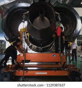 Aircraft Mechanic Putting Aircraft Engine On Engine Cradle