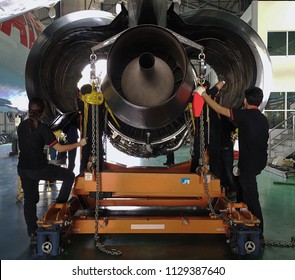 Aircraft Mechanic Putting Aircraft Engine On Engine Cradle