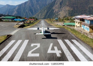 The aircraft on the runway of the Tenzing-Hillary airport Lukla - Nepal, Himalayas - Powered by Shutterstock