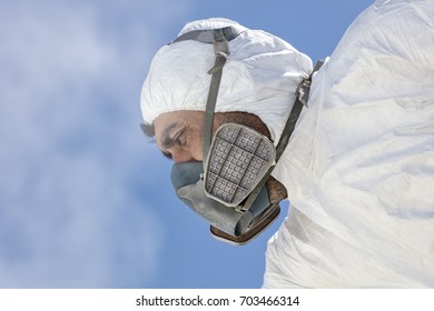 Aircraft Painting And Sandblasting.  Spray Painting, Airplane Wing. Worker In Coverall Using Airbrush. Passenger Aircraft During Maintenance And Painting.