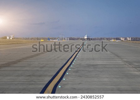Aircraft perform taxiing on taxiway. Transportation scene