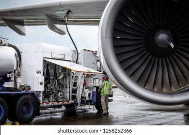 Aircraft Refueling By High Pressure Fuel Supply Truck.Passenger Jet Airplane Refuel From Supply Truck, Airport Service, Refuel,Aircraft Refueling Hose.