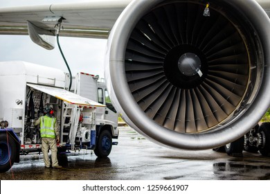 Aircraft Refueling By High Pressure Fuel Supply Truck.Passenger Jet Airplane Refuel From Supply Truck, Airport Service, Refuel,Aircraft Refueling Hose.