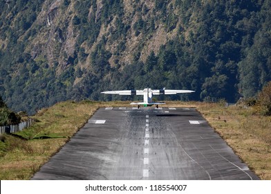 The aircraft takes off on the runway of the Tenzing-Hillary airport Lukla - Nepal, Himalayas - Powered by Shutterstock