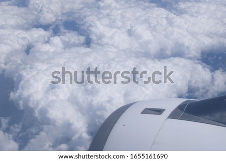 Aircraft window view clouds engine sky