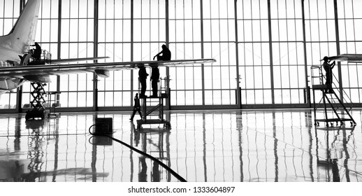 Aircraft(airplane)in aircraft hangar for maintenance service check by aircraft technician.Maintenance before flight. - Powered by Shutterstock