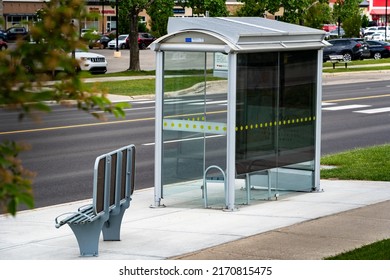 Airdrie Alberta Canada, June 12 2022: Bus Stop Transit Shelter With Solar Panels On The Roof For Sustainable Energy Production.