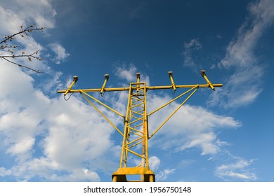 Airfield Lights Used For Airplanes To Land Or Fly Next To An Airport. Blue Sky Background. Transportation Industry.