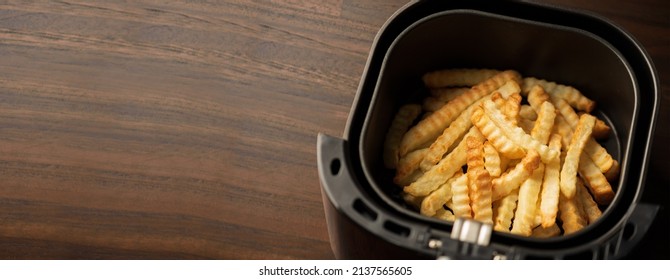 Airfryer Tray machine cooking. grilled potato.French fries  - Shutterstock ID 2137565605