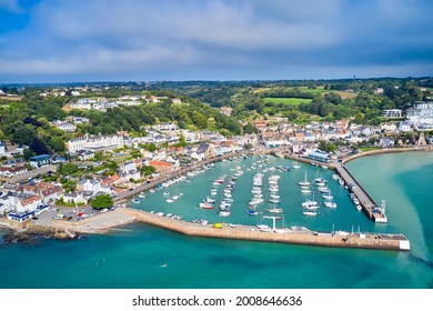 Airial drone image of St Aubn's Harbour and Village at high tide in the sunshine. Jersey Channel Islands