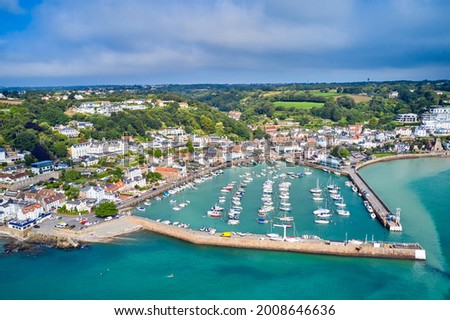 Airial drone image of St Aubn's Harbour and Village at high tide in the sunshine. Jersey Channel Islands