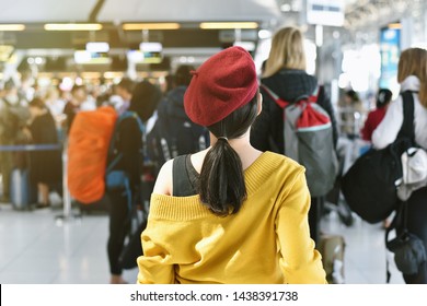 Airline Check-in Counter Queue At International Airport With Blurred Of Crowded Passenger Background, Asian Woman Traveler Waiting Hour Long For Boarding Security Check Line.