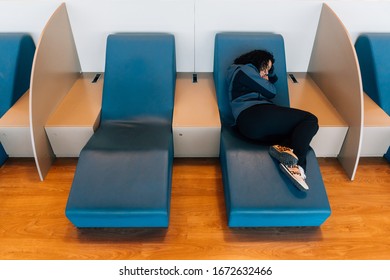 Airline Passenger Rests In An Airport VIP Room Waiting For Her Flight.