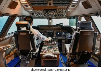 Airline Pilot Work In The Cockpit