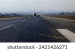 airline is ready to fly on the runway with cityscape background, tribhuvan international airport, kathmandu
