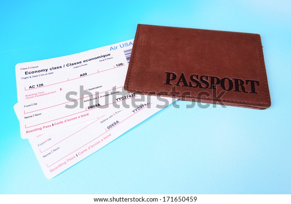 Airline Tickets Passport On Light Blue Stock Photo Edit Now