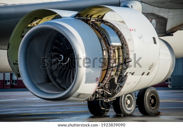 airliner engine with open cowlings for a engine\
check after maintenance. MRO companies are a very important part to\
keep passengers safe during\
flight