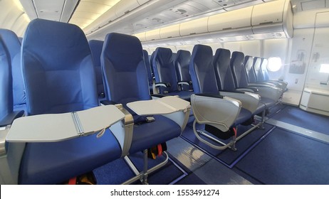 Airlines Seat. Blue seats in the cabin of the plane 