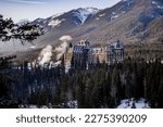 airmont Banff Springs hotel during winter sunrise in banff with mountains on background