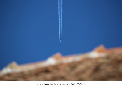 Airplain Flies On The Clear Sky