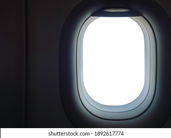 Airplane, Aircraft Window With White Blank Space. Window View From Passenger Seat On Commercial Airplane, Dark Passenger Cabin With Copy Space.