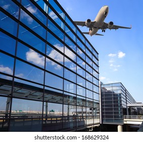 Airplane And Airport Terminal Building In Shanghai 