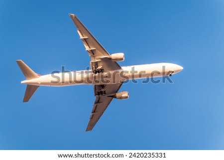 Airplane before landing in blue sky, Airbus A330. Air Transport. Tourism and travel concept.