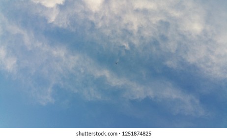 Airplane between clouds 