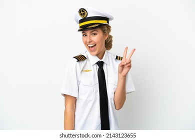 Airplane Blonde Woman Pilot Isolated On White Background Smiling And Showing Victory Sign