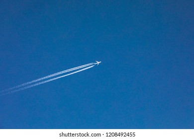 an airplane in the blue sky