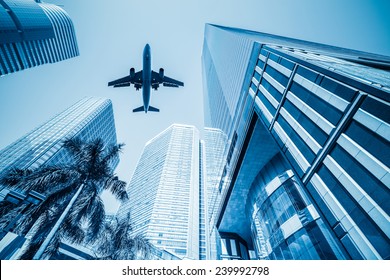 Airplane And Business Buildings ,viewed From Below 