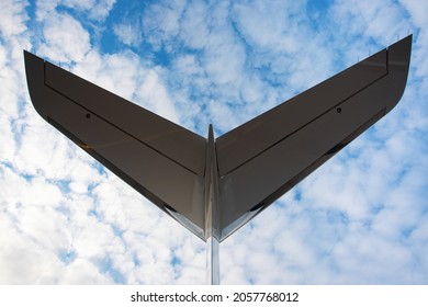 An Airplane Business Jet Tail Close-up Image On Beautiful Sky