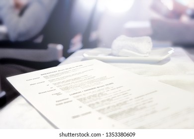 Airplane Business Travel Food Menu On Tray Table With Selection Of Breakfast Lunch Dinner Meal And Beverages Onboard Of Aircraft First Class Interior Cabin Luxury Jet Plane Inflight Service Background