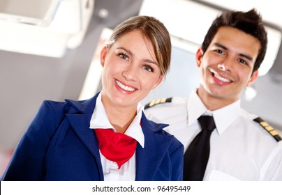 Airplane Cabin Crew With Pilot And Flight Attendant Smiling